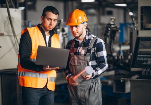 Two colleagues at a factory